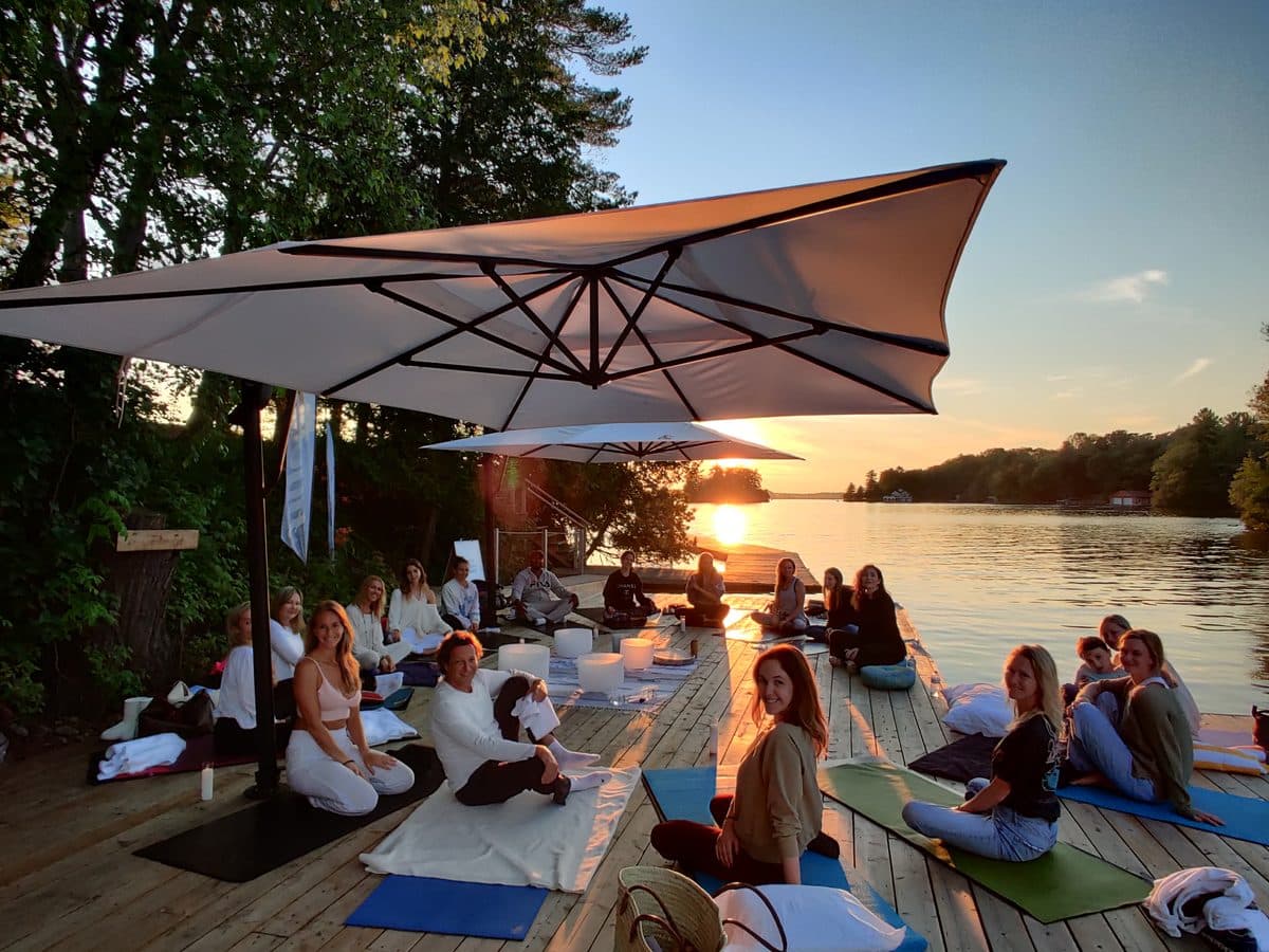 An outdoor session at sunset beside the water